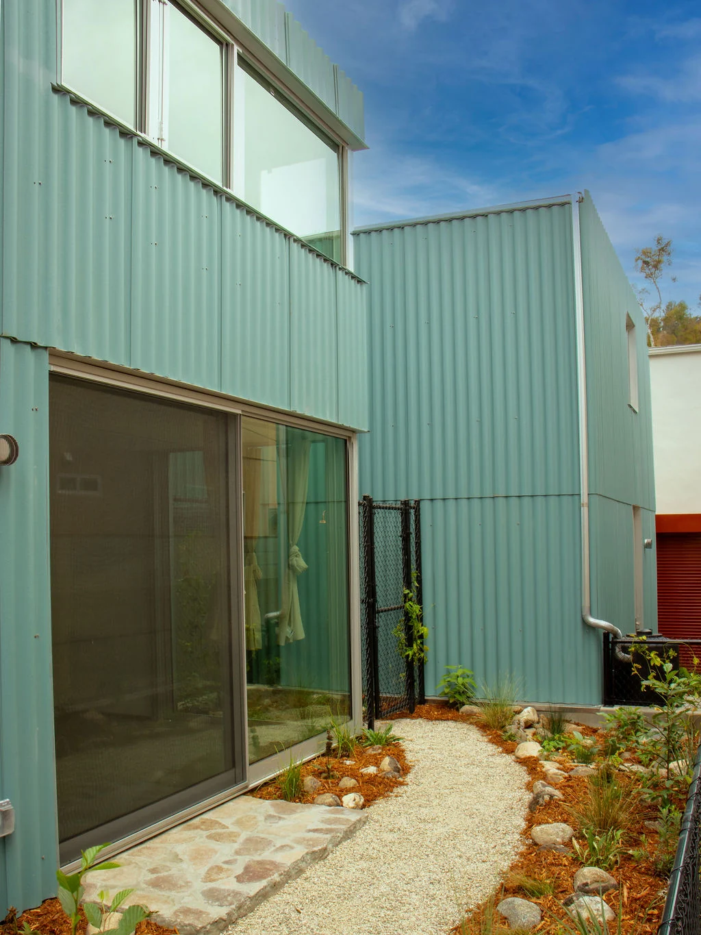 Careful landscape and exterior detailing at Solano Ave IT House